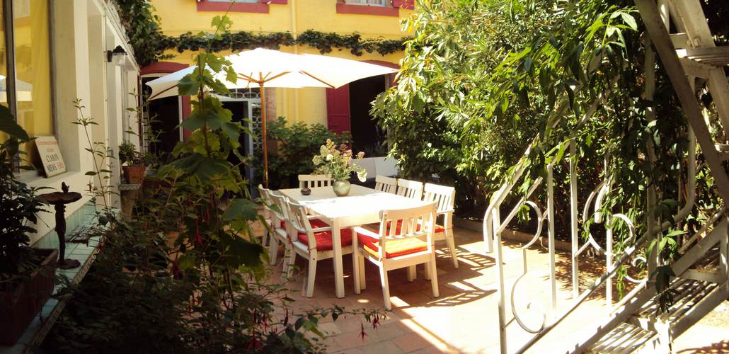 The raised patio and the the summer dining room table